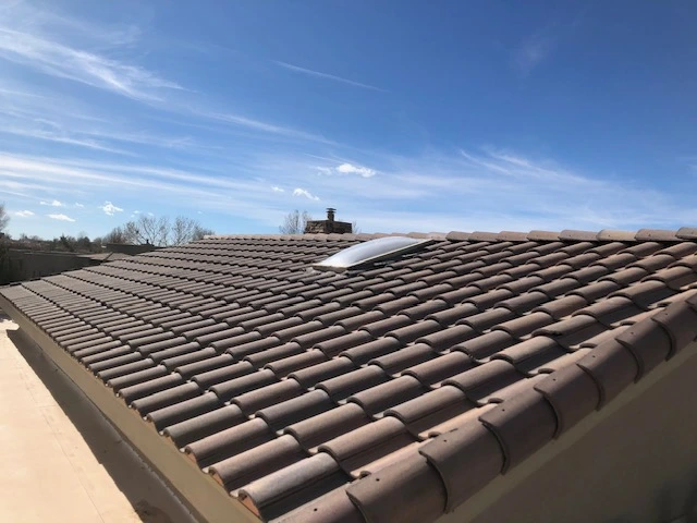 A roof featuring a solar panel, showcasing sustainable energy solutions in a residential setting.